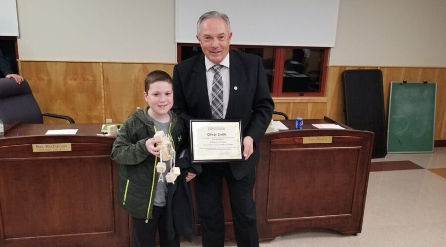 Local boy presents OllieBots to municipal councillors