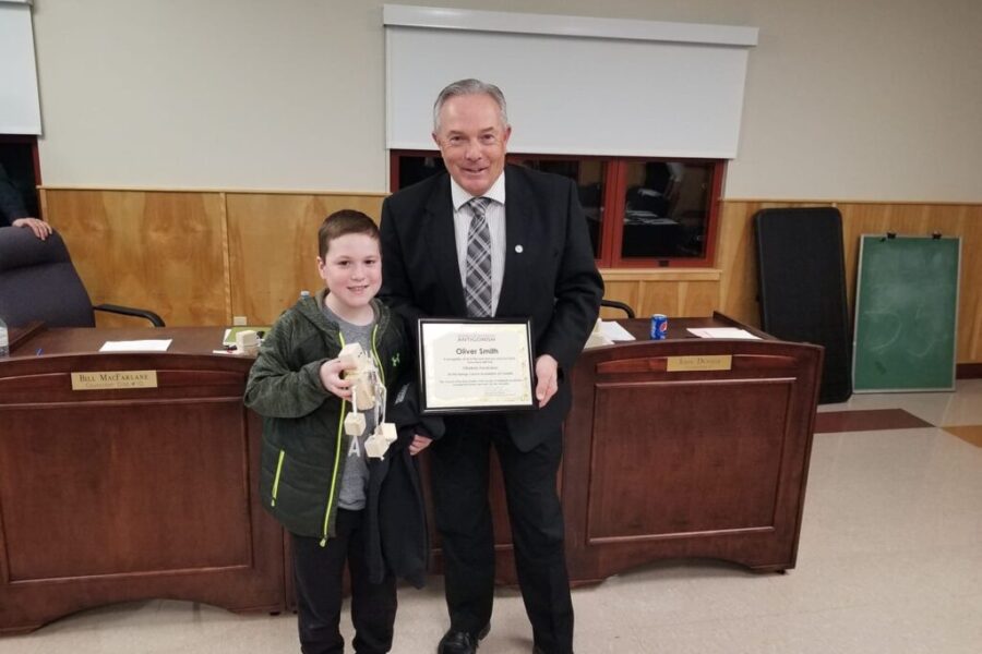 Local boy presents OllieBots to municipal councillors