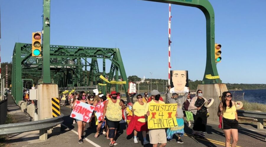 Group marching across causeway for woman killed by police officer
