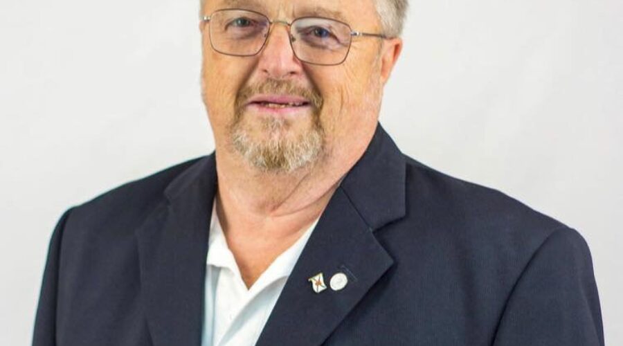 Cotter carrying Conservative banner in Central Nova