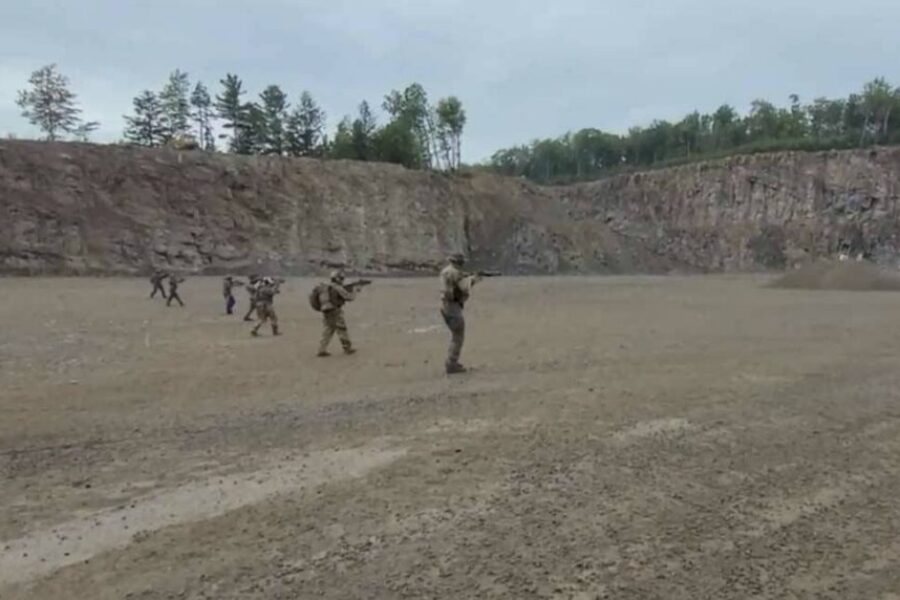 Four, including military members, charged in relation to terrorist group